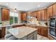 Beautiful kitchen with stainless steel appliances and spacious center island at 5207 Denim Ct, Parker, CO 80134