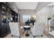 Elegant living room featuring high ceilings, a piano, and stylish decor at 5207 Denim Ct, Parker, CO 80134