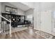 Bright living room with a grand piano, built-in bookshelves, and natural light at 5207 Denim Ct, Parker, CO 80134