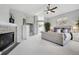 Bright main bedroom featuring a fireplace, a vaulted ceiling and neutral décor at 5207 Denim Ct, Parker, CO 80134
