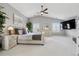 Spacious main bedroom with vaulted ceiling, large windows, ceiling fan, and a mounted television at 5207 Denim Ct, Parker, CO 80134