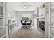 Bright office space featuring hardwood floors, fireplace, and large windows at 5207 Denim Ct, Parker, CO 80134