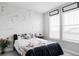 Stylish bedroom features modern accents and a comfortable bed adorned with decorative pillows at 500 176Th Ave, Broomfield, CO 80023