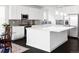Bright kitchen with white cabinetry, stainless steel appliances, and a large center island at 500 176Th Ave, Broomfield, CO 80023