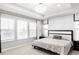 Bright main bedroom features a tray ceiling with a chandelier and large windows for ample natural light at 500 176Th Ave, Broomfield, CO 80023