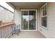 Covered patio with sliding glass doors and metal furniture, offering a relaxing outdoor living space at 500 176Th Ave, Broomfield, CO 80023