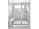Walk-in shower with gray tiles, glass door, and a built-in bench for added comfort at 500 176Th Ave, Broomfield, CO 80023