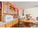 Basement bar area with ample cabinet space and built in appliances at 14939 E Harvard Ave, Aurora, CO 80014