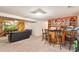 Basement is spacious with a bar area and comfortable lounge seating at 14939 E Harvard Ave, Aurora, CO 80014