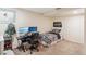 Bedroom area with a desk setup, neutral walls, and carpet flooring at 14939 E Harvard Ave, Aurora, CO 80014
