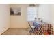Bedroom area features a simple study space and a sunny window at 14939 E Harvard Ave, Aurora, CO 80014
