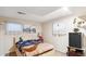 Cozy bedroom with bright windows and a patterned comforter set at 14939 E Harvard Ave, Aurora, CO 80014