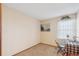 Spare bedroom with carpet, desk, Eiffel Tower picture, chair and natural light from window at 14939 E Harvard Ave, Aurora, CO 80014