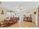 Inviting dining room featuring wood floors, large window and decorative light fixtures at 14939 E Harvard Ave, Aurora, CO 80014