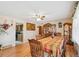 Formal dining room with wood floors, ceiling fan, and vintage china cabinet at 14939 E Harvard Ave, Aurora, CO 80014