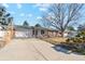 Charming single-story home featuring a spacious driveway and attached two-car garage at 14939 E Harvard Ave, Aurora, CO 80014