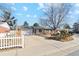 Charming single-story home featuring a spacious driveway and attached two-car garage at 14939 E Harvard Ave, Aurora, CO 80014