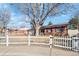 Charming single-story home featuring a spacious driveway and landscaped front yard at 14939 E Harvard Ave, Aurora, CO 80014