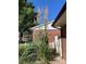 Well-maintained landscaping with vibrant pampas grass adding natural beauty to the home's exterior at 14939 E Harvard Ave, Aurora, CO 80014