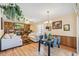 Bright living room flowing into the dining area with a view of the fireplace at 14939 E Harvard Ave, Aurora, CO 80014