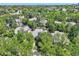 Gorgeous aerial view of landscaped homes nestled among mature trees in community at 85 Silver Fox Dr, Greenwood Village, CO 80121