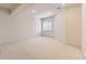 Finished carpeted basement rec room with bright ceilings and a window for natural light at 85 Silver Fox Dr, Greenwood Village, CO 80121