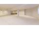 A finished carpeted basement rec room area, featuring a wet bar at 85 Silver Fox Dr, Greenwood Village, CO 80121