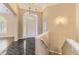 Foyer featuring a marble floor, large doorway, with a staircase leading upstairs at 85 Silver Fox Dr, Greenwood Village, CO 80121