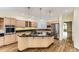Modern kitchen featuring stainless steel appliances, granite countertops, and hardwood floors at 85 Silver Fox Dr, Greenwood Village, CO 80121