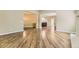 Spacious living area featuring hardwood floors and an open layout to the dining space at 85 Silver Fox Dr, Greenwood Village, CO 80121