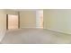 Neutral carpeted room with windows and access to additional areas at 85 Silver Fox Dr, Greenwood Village, CO 80121