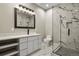 Modern bathroom features marble tile, glass shower, sleek vanity, and contemporary lighting at 16250 Kenosha St, Brighton, CO 80603