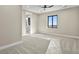 Bedroom featuring plush carpeting, a ceiling fan, and a window with views of the landscape at 16250 Kenosha St, Brighton, CO 80603