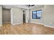 Spacious bedroom with hardwood floors, a window, and a closet at 16250 Kenosha St, Brighton, CO 80603