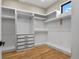 Spacious closet with custom shelving, drawers, and ample storage space at 16250 Kenosha St, Brighton, CO 80603