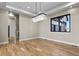 Elegant dining room with a modern chandelier and hardwood floors at 16250 Kenosha St, Brighton, CO 80603