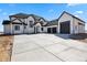 Stunning modern home with a large driveway and three-car garage at 16250 Kenosha St, Brighton, CO 80603
