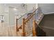 Inviting foyer with hardwood floors, a staircase, and elegant lighting at 16250 Kenosha St, Brighton, CO 80603