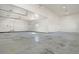 Expansive garage with high ceilings, ample space, and multiple entry points at 16250 Kenosha St, Brighton, CO 80603