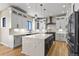 Spacious kitchen with stainless appliances, island with eating space, granite countertops, and modern pendant lights at 16250 Kenosha St, Brighton, CO 80603