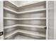 Spacious walk-in pantry with an abundance of shelving providing ample storage space for supplies at 16250 Kenosha St, Brighton, CO 80603
