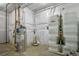 Functional utility room with water heater, water filtration system, and storage solutions at 16250 Kenosha St, Brighton, CO 80603