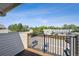 This balcony offers a nice view of the community, with metal railings and a wood-look deck at 6007 Yarrow St # I, Arvada, CO 80004