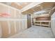 Unfinished basement with workbench, pegboard, and concrete floor ready to be customized at 6007 Yarrow St # I, Arvada, CO 80004
