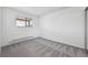 Bedroom with plush gray carpet, a window, and a baseboard heater, freshly painted and ready for personalization at 6007 Yarrow St # I, Arvada, CO 80004