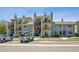 Modern condo with multiple units featuring private balconies, black railings, and tidy landscaping at 6007 Yarrow St # I, Arvada, CO 80004