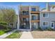 Inviting exterior view of a multi-level home with private balconies and well-maintained landscaping at 6007 Yarrow St # I, Arvada, CO 80004