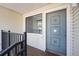 Close-up of the front door featuring a secure entry, screen and decorative moldings for enhanced curb appeal at 6007 Yarrow St # I, Arvada, CO 80004