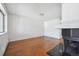Bright and airy living space featuring hardwood floors, fireplace, and large windows at 6007 Yarrow St # I, Arvada, CO 80004