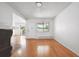 A spacious living room with a fireplace and large window offering plenty of natural light at 6007 Yarrow St # I, Arvada, CO 80004